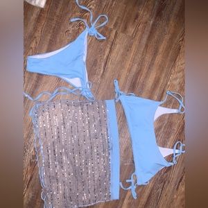 3 pc set baby blue swimsuit. With a baby blue and sliver skirt cover up.